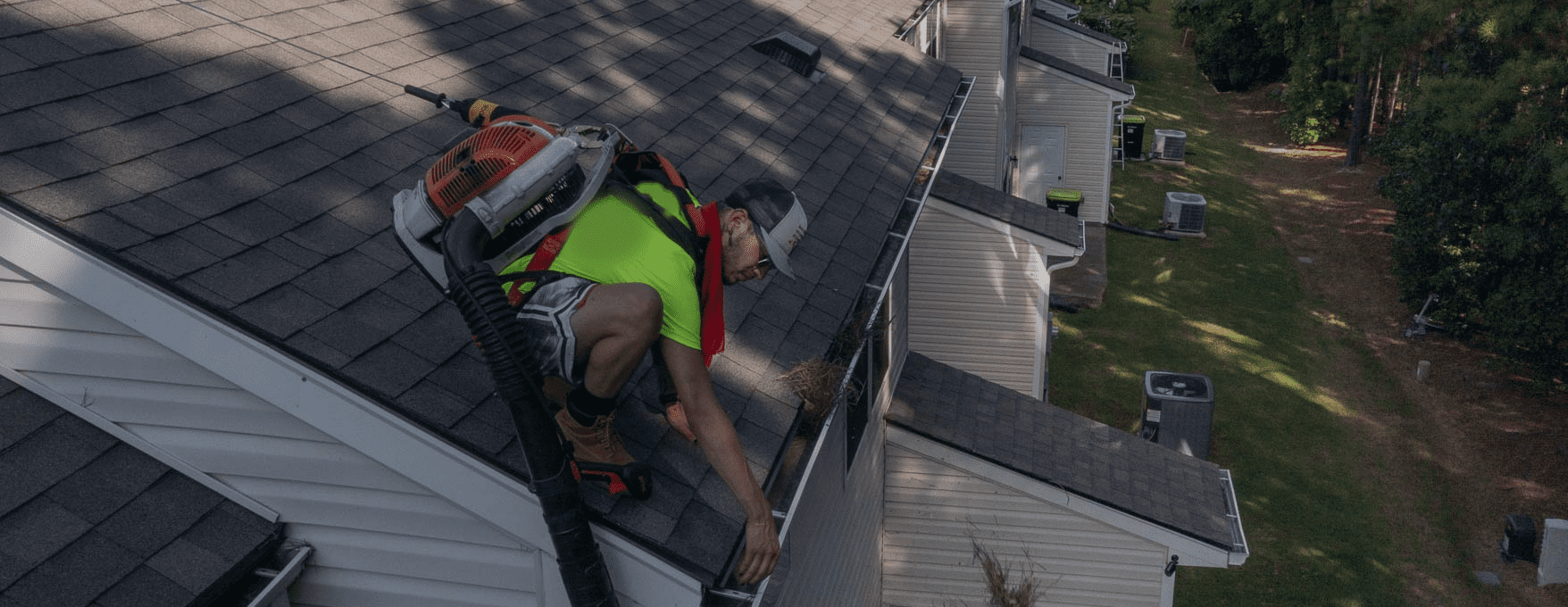 Guy on roof cleaning gutters in Sutherland Shire